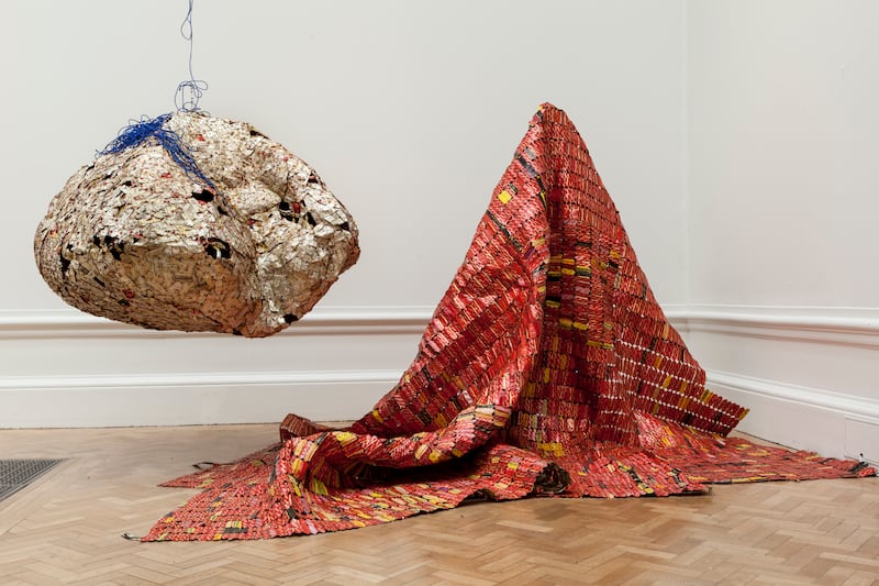 One of Ghanaian sculptor El Anatsui's signature pieces of cloth, made from reused bottle caps and packaging material. El Anatsui’s work will be shown across several botanical gardens in September. Courtesy Jonathan Greet