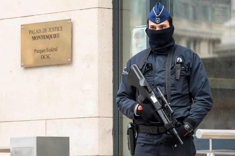 A policeman guards the Belgian Federal Prosecutor's office in Brussels on January 16, 2015. Geert Vanden Wijngaert/AP Photo