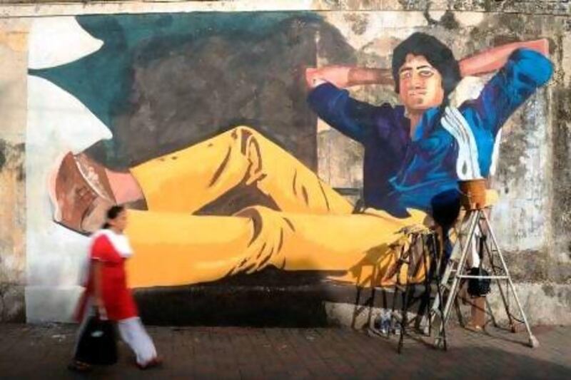 A mural of Amitabh Bachchan. Indranil Mukherjee / AFP