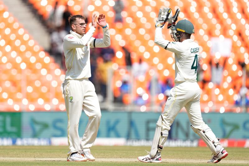 Australia's Todd Murphy, left, celebrates the wicket India's Cheteshwar Pujara. AP