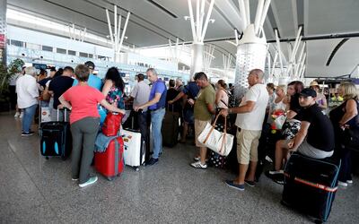 Passengers are seen at Thomas Cook check-in points at Enfidha-Hammamet International Airport, Tunisia September 23, 2019. REUTERS/Zoubeir Souissi