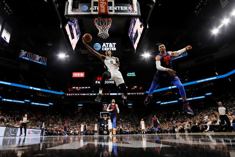 San Antonio Spurs point guard Dejounte Murray shoots the ball past Oklahoma City Thunder point guard Russell Westbrook. Soobum Im USA TODAY Sports