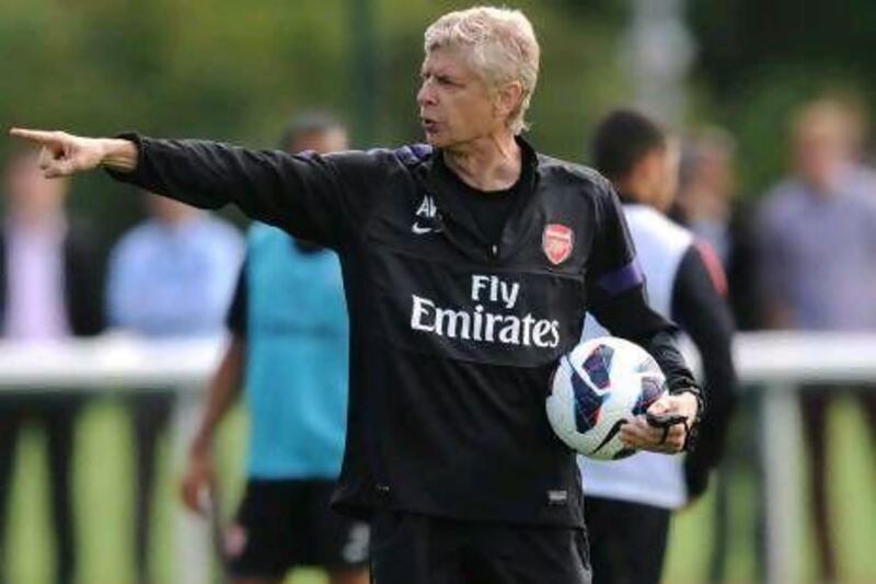 Arsene Wenger wants Arsenal to stick to their passing principles. Stuart MacFarlane / Getty Images