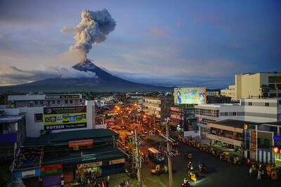 Life goes on in downtown Legazpi City as Mayon volcano continues to spew lava and huge plumes of ash, with lava fountains gushing up into the sky on January 25, 2018. Mount Mayon, is an 8,070-foot (2,460-meter) volcano being known for its near perfectly symmetrical cone shape is located in the province of Albay, about 340 kilometers (210 miles) southeast of Manila Philippines. Courtesy Xposure