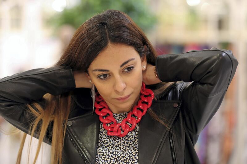 Dubai, United Arab Emirates - Reporter: Panna Munyal. Fashion. Shopping. A lady tries on jewelry on display from Labam. Pop-up of eight Italian boutique brands at Galeries Lafayette at The Dubai Mall. Tuesday, March 23rd, 2021. Dubai. Chris Whiteoak / The National