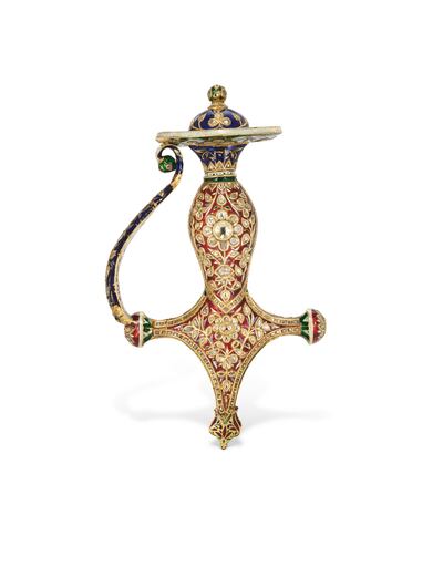 Lot 67 - An enameled and gem-set gold tulwar hilt. Possibly Jaipur, North India, 19th century. Photo: Christie's 