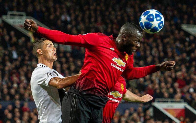 Juventus' Cristiano Ronaldo, left, in action with Manchester United's Romelu Lukaku. EPA