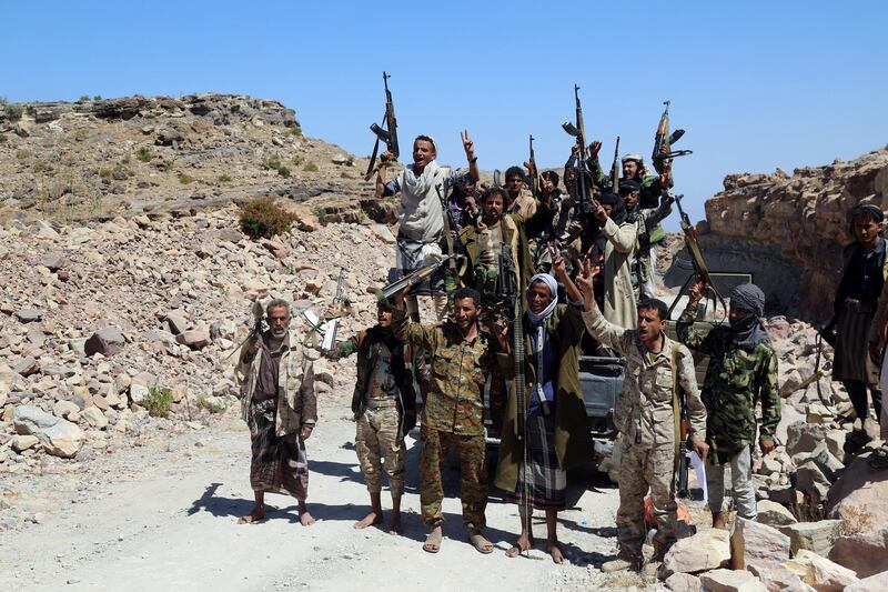 Pro-government fighters react as they made advances on Houthi fighters in al-Selw district of Taiz, Yemen January 30, 2018. REUTERS/Stringer NO RESALES. NO ARCHIVE