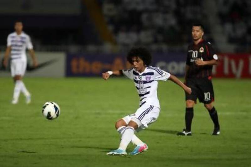 Omar Abdulrahman, right, is said to have courted interest from a number of European clubs, although none have submitted what Al Ain regard as a concrete offer for the UAE international playmaker. AFP