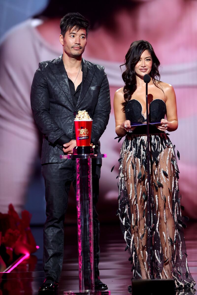 From left to right: Kevin Kreider and Kim Lee speak onstage. Getty Images / AFP
