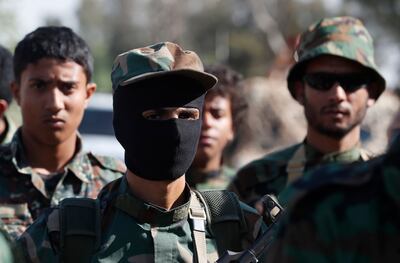 Houthi forces take part in a military parade in Sanaa. EPA