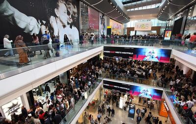 FILE PHOTO: Shoppers crowd the walkways on opening day of the Westfield Stratford City shopping centre in east London September 13, 2011.   REUTERS/Suzanne Plunkett/File Photo