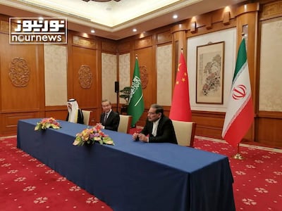From left, Saudi Arabia's National Security Adviser Musaad Al Aiban, China's most senior diplomat Wang Yi and Ali Shamkhani, secretary of Iran's Supreme National Security Council sign an agreement earlier this year. AP