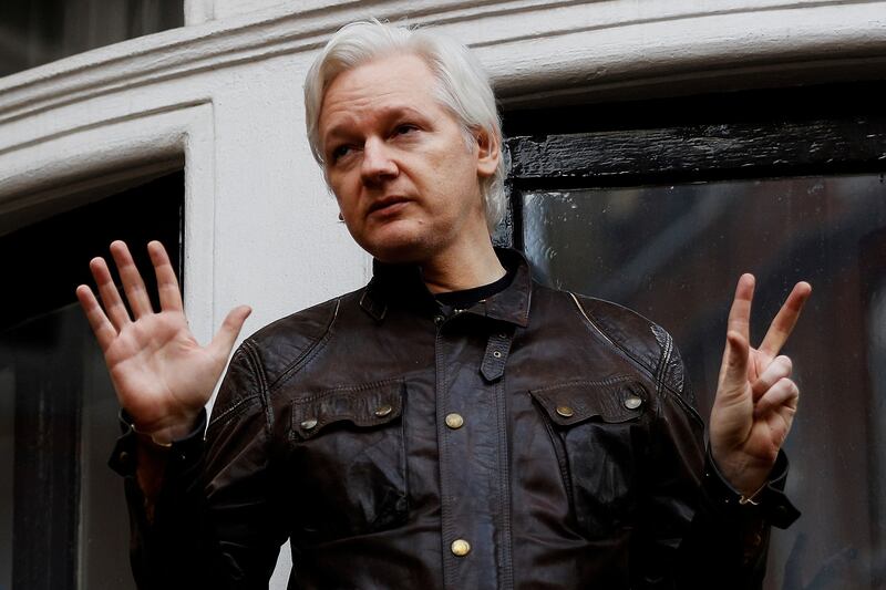 Mr Assange on the balcony of the Ecuadorian embassy in London, in May 2017. Reuters