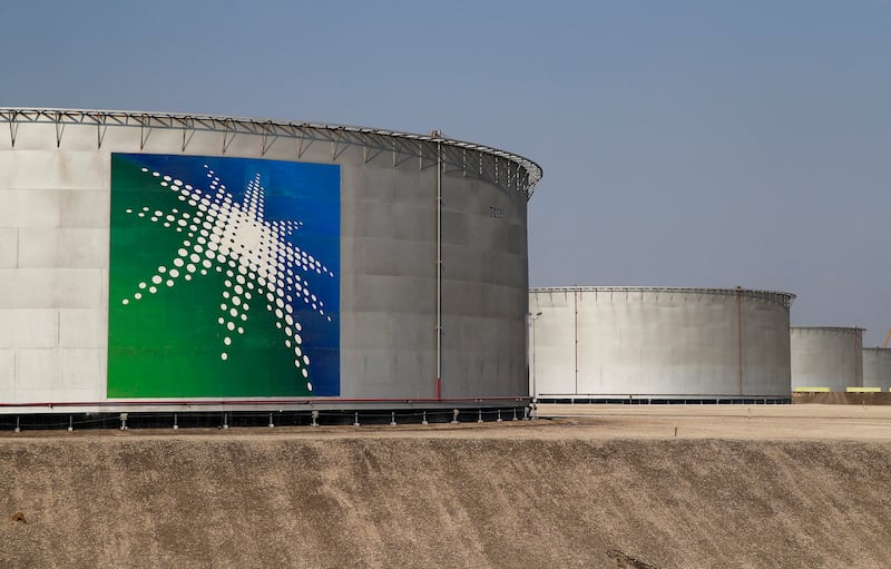 Aramco oil tanks in Abqaiq, Saudi Arabia. The state energy company will raise crude production to 13 million barrels per day by 2027. Reuters
