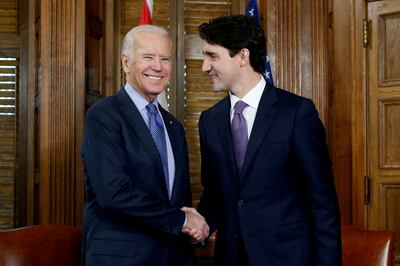 FILE PHOTO: Canada's Prime Minister Justin Trudeau (R) shakes hands with U.S. Vice President Joe Biden during a meeting in Trudeau's office on Parliament Hill in Ottawa, Ontario, Canada, December 9, 2016. REUTERS/Chris Wattie/File Photo/File Photo