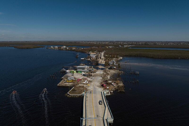 Residents are being encouraged to leave because the only road on to the island was made impassable, and electricity and water were cut by Hurricane Ian. AFP