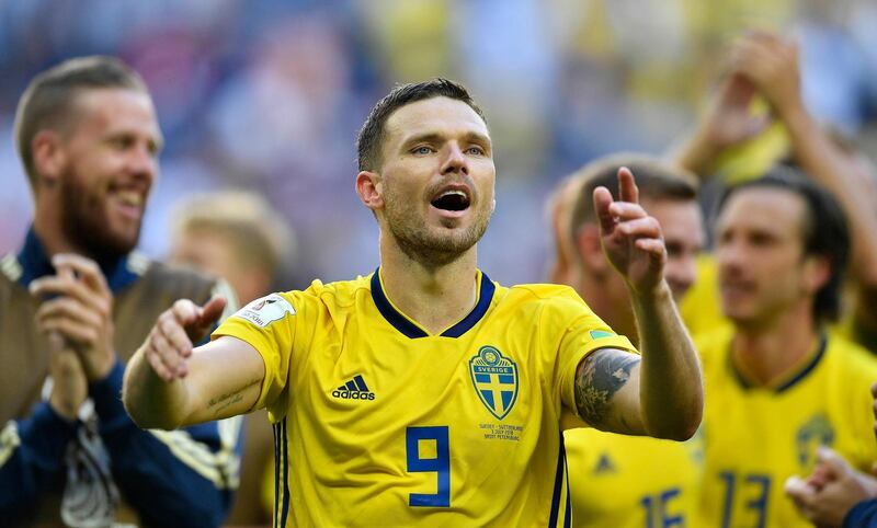 Sweden's Marcus Berg celebrates with teammates after winning the round of 16 match between Switzerland and Sweden at the 2018 soccer World Cup in the St. Petersburg Stadium, in St. Petersburg, Russia, Tuesday, July 3, 2018. (AP Photo/Martin Meissner)