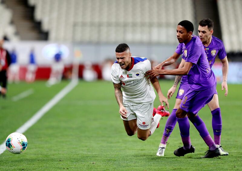 Abu Dhabi, United Arab Emirates - Reporter: John McAuley: Marcus Vinicius of Sharjah takes on Caio and Salem Abdulla (3) of Al Ain in the game between Sharjah and Al Ain in the PresidentÕs Cup semi-final. Tuesday, March 10th, 2020. Mohamed bin Zayed Stadium, Abu Dhabi. Chris Whiteoak / The National