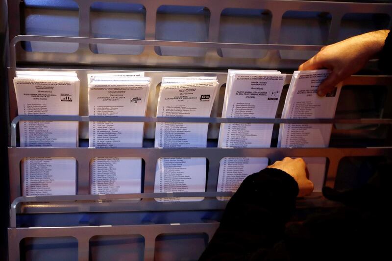 epa06400160 A worker displays ballots at the City Hall of Barcelona, Catalonia, Spain, 20 December 2017, on the day before the Catalonian regional elections, scheduled for 21 December 2017. Regional elections in Catalonia will be held to elect all 135 seats in the Catalan regional parliament, as the Spanish central government applied article 155 of the Constitution following the regional parliament's unilateral declaration of independence.  EPA/ALBERTO ESTEVEZ