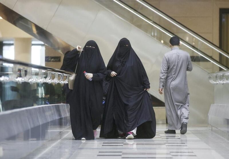 Female Saudi shoppers walk through the Kingdom Centre shopping mall in Riyadh on December 2, 2016. Simon Dawson / Bloomberg