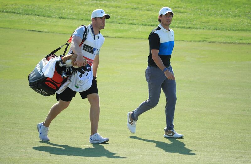 Rory McIlroy of Northern Ireland with his caddie Niall OConnor on the 12th hole at the Jumeirah Golf Estates. Getty Images