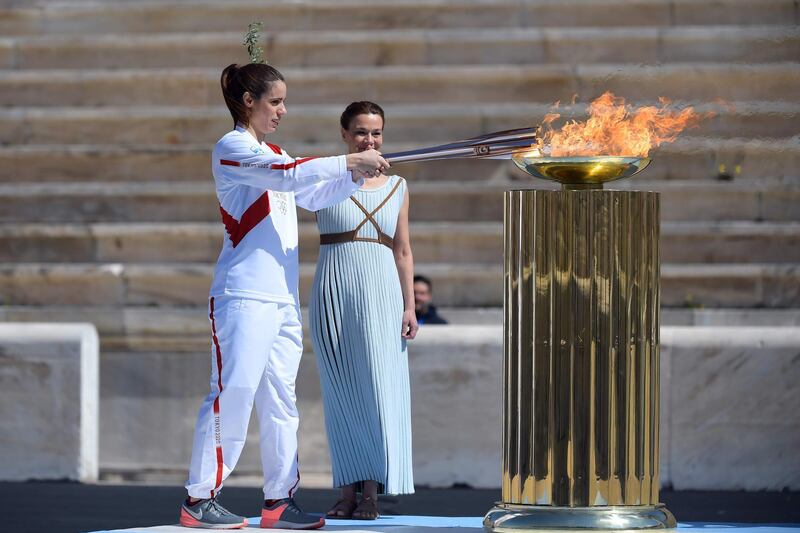 The Olympic torch is lit during the flame handover ceremony in Athens for the 2020 Tokyo Olympics. AFP