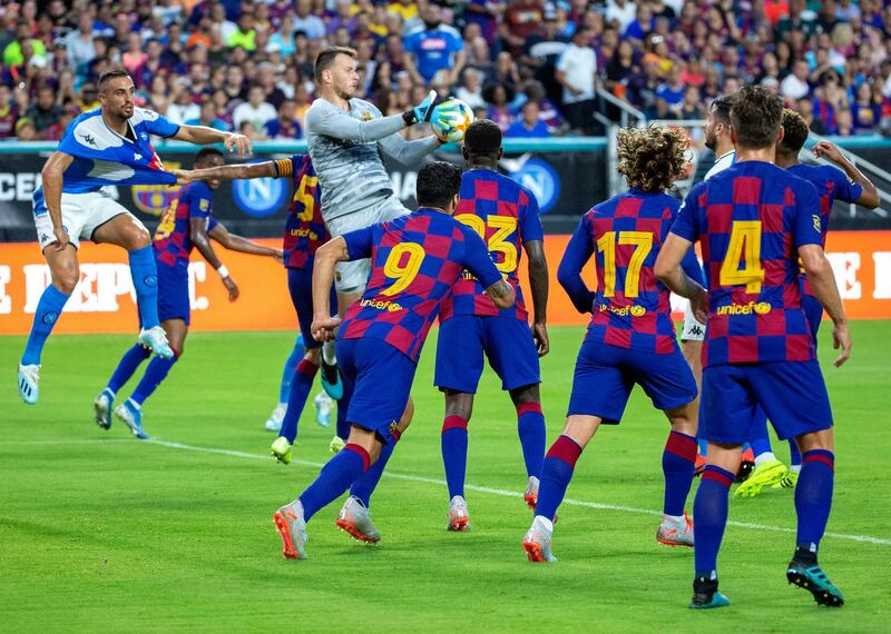 Barcelona's goalkeeper Neto catches the ball as his teammates watch on. EPA