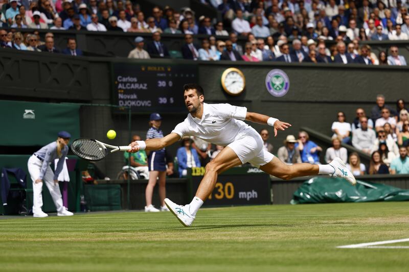 Novak Djokovic stretches to make a return. EPA 