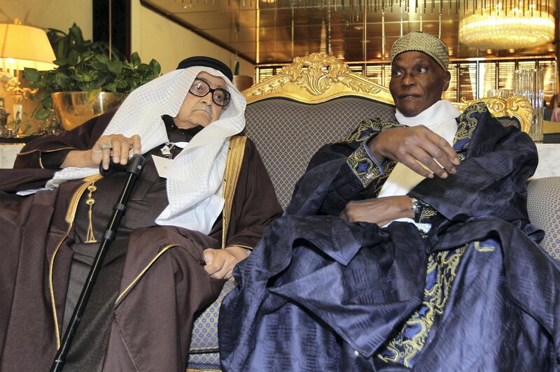 Saudi businessman Sheikh Saleh Kamel (L) sits next to Senegal's President Abdoulaye Wade during the Gulf-Africa investment conference in Riyadh December 4, 2010.    REUTERS/Fahad Shadeed   (SAUDI ARABIA - Tags: BUSINESS POLITICS)