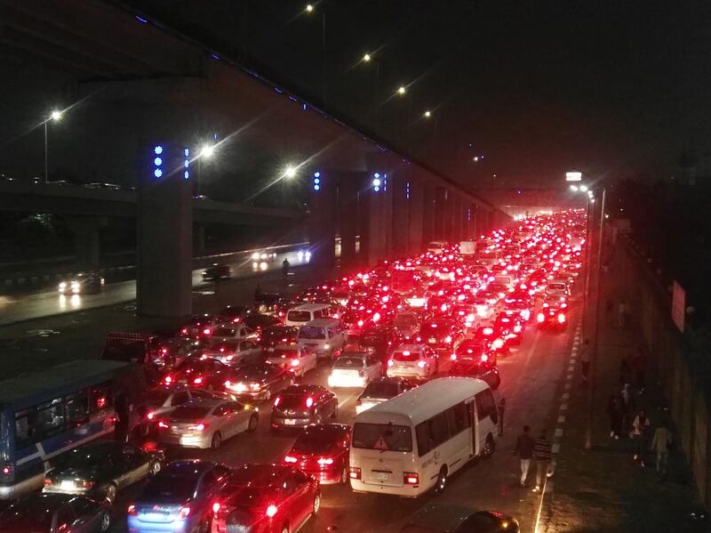 Vehicles are stuck in a traffic jam due to rain in the Egyptian capital Cairo.  AFP