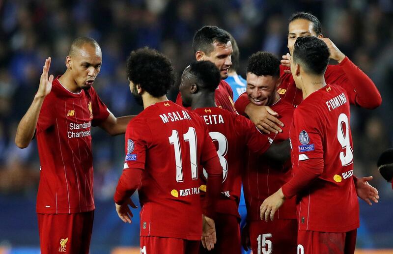 Alex Oxlade-Chamberlain celebrates with teammates after scoring the second goal against Genk. Reuters