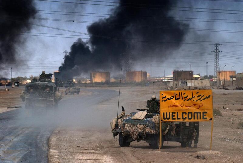 US marines entering in the southern Iraqi city of Nasiriyah, where allied troops found stubborn resistance in their northbound advance torwards the Iraqi capital of Baghdad in March 23, 2003. Eric Feferberg/AP Photo 