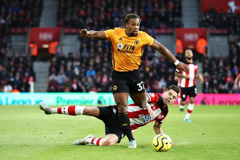 SOUTHAMPTON, ENGLAND - JANUARY 18: Adama Traore of Wolverhampton Wanderers is challenged by Jan Bednarek of Southampton during the Premier League match between Southampton FC and Wolverhampton Wanderers at St Mary's Stadium on January 18, 2020 in Southampton, United Kingdom. (Photo by Bryn Lennon/Getty Images)