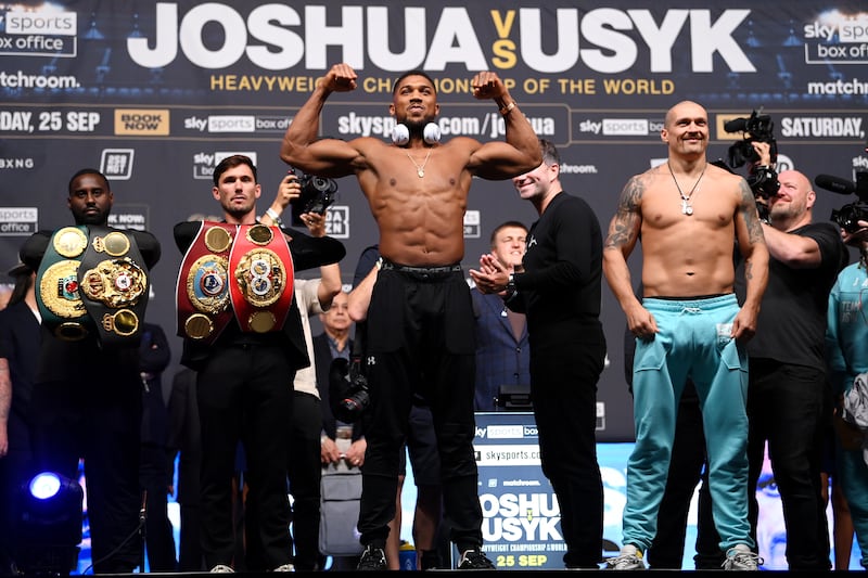 Anthony Joshua and Oleksandr Usyk pose following their weigh in ahead of the heavyweight title fightat Cineworld 02 Arena on September 24, 2021 in London, England. Getty Images