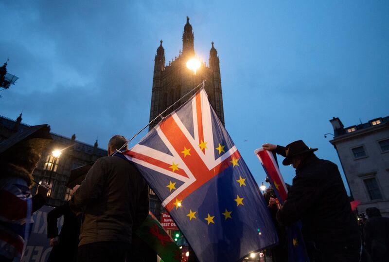 Pro-EU flags fly outside the Houses of Parliament. EPA