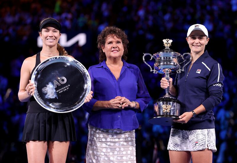 Australia's Ashleigh Barty, right, celebrates as she holds the Australian Open trophy with Danielle Collins of the US  and former Australian Open champion Evonne Goolagong Cawley. Reuters