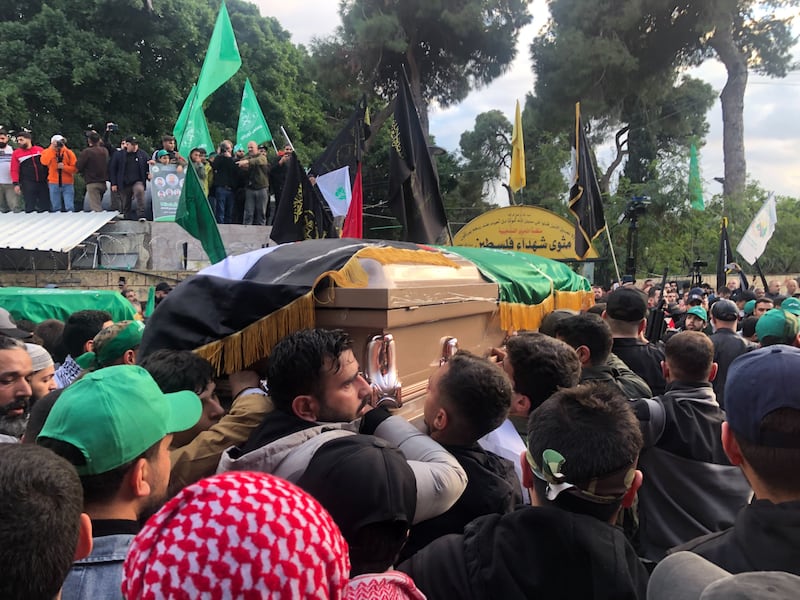The funeral procession for Mr Al Arouri and others killed in the strike. Nada Atallah / The National