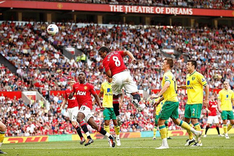 Anderson, the Manchester United midfielder, centre, rises the highest to head home United's first in their hard-fought 2-0 win against Norwich City.

Jon Super / AP Photo