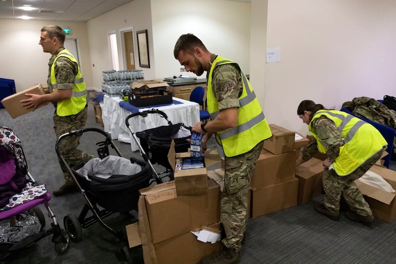 RAF personnel pack necessities for Afghan nationals arriving at RAF Brize Norton, in England. AP Photo