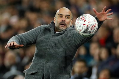 Soccer Football - FA Cup Quarter Final - Swansea City v Manchester City - Liberty Stadium, Swansea, Britain - March 16, 2019  Manchester City manager Pep Guardiola with the match ball            Action Images via Reuters/John Sibley     TPX IMAGES OF THE DAY