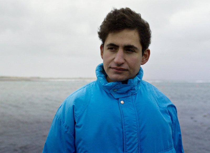 In this image made from video provided by Focus Features, Amir El-Masry stars as "Omar" in director Ben Sharrock's â€œLimboâ€, a film about refugees waiting on a remote Scottish island for residency. The film is based on writer Ben Sharrockâ€™s own experience of studying and living in Arab countries, visiting refugee camps and rooted in the fact that asylum seekers are often sent to remote areas of northern European countries while they wait to hear their fate. (Focus Features via AP)