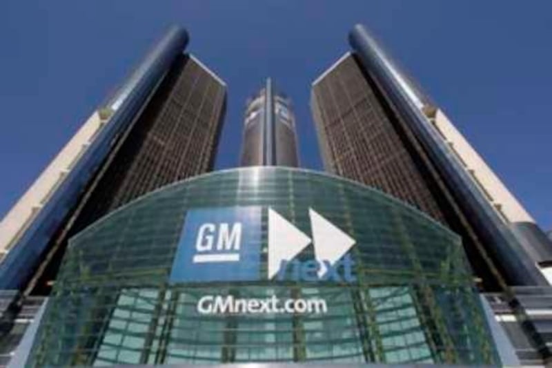 ** FILE ** A Sept. 16, 2008 file photo shows General Motors Renaissance Center headquarters building in Detroit.   President-elect Obama, when he met with President Bush at the White House on Monday, Nov. 10, 2008, urged Bush to support aid for struggling automakers and Democrats in Congress have begun drafting legislation that would give General Motors, Ford and Chrysler access to $25 billion.   (AP Photo/Paul Sancya/file) *** Local Caption ***  NY115_FINANCIAL_MELTDOWN.jpg