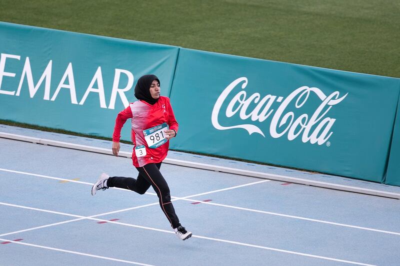 DUBAI, UNITED ARAB EMIRATES - March 16 2019.
Hamda Al Hosani wins first place at the 200m run at the Special Olympics World Games athletics competition in Dubai Police Academy Stadium.

 (Photo by Reem Mohammed/The National)

Reporter: 
Section:  NA