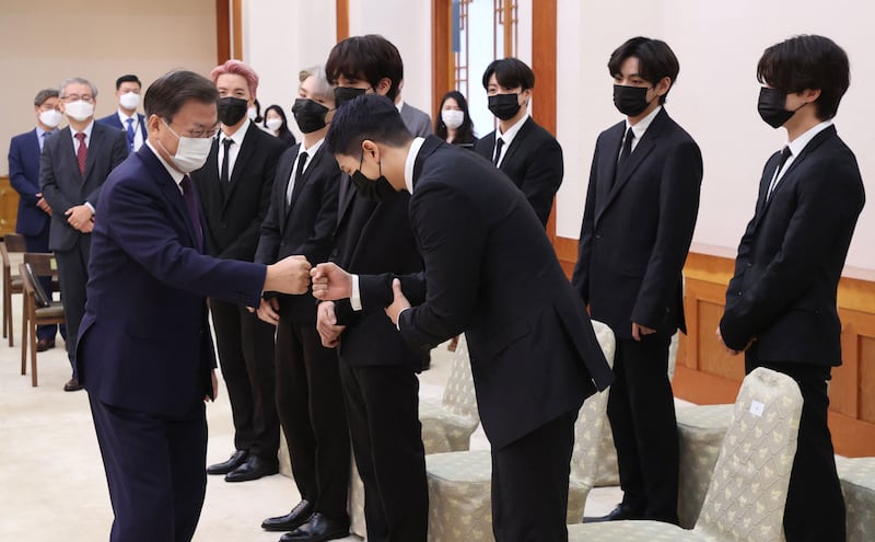 President Moon Jae-in greeting members of BTS. AFP