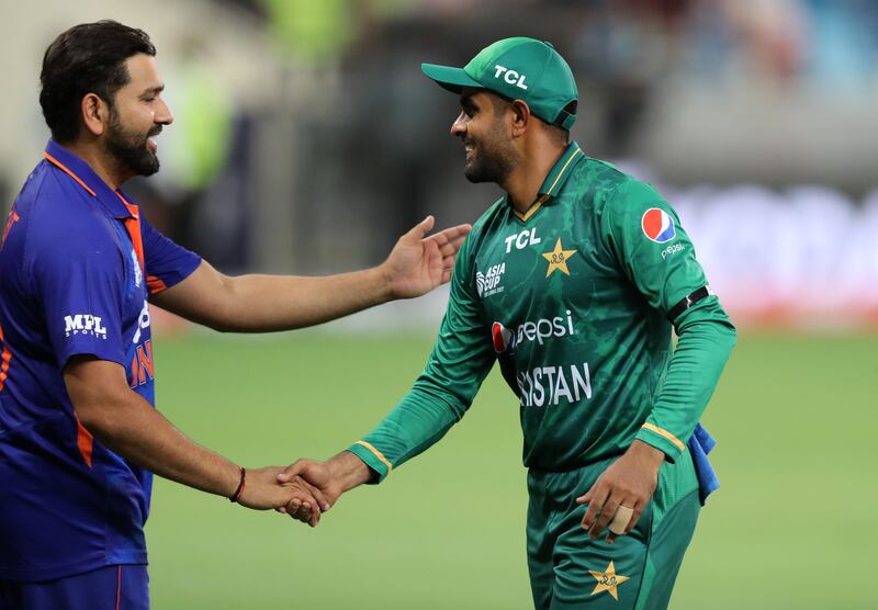 India captain Rohit Sharma shakes hands with Pakistan captain Babar Azam after the win. 