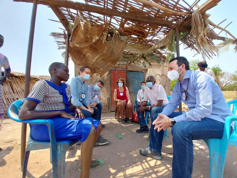 During a visit to South Sudan in 2021, Mr Mardini speaks to a patient who lost her leg when she was five years old, in Rumbek. The Rumbek Centre has provided her with a prosthesis and financial support from the ICRC has enabled her to open a tea shop