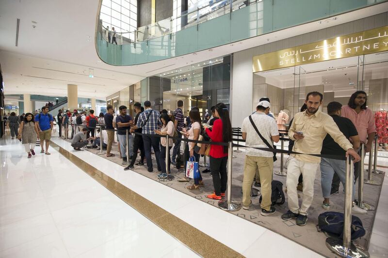 DUBAI, UNITED ARAB EMIRATES, 20 SEPTEMBER 2018 - Crowd waiting in queue to get the new iphone XS at Apple store in Dubai Mall.  Leslie Pableo for The National for Patrick Ryan’s story