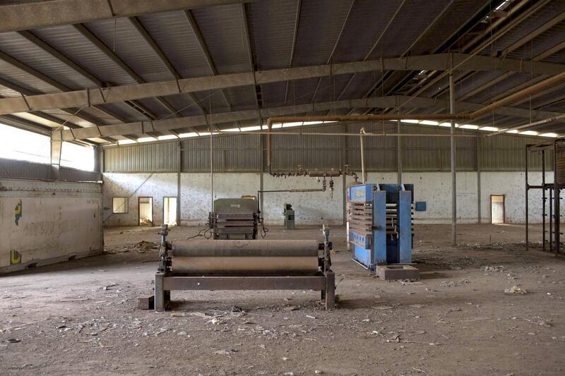 Broken machinery is seen at the defunct plywood company FOLBI in Buba. Joe Penney / Reuters