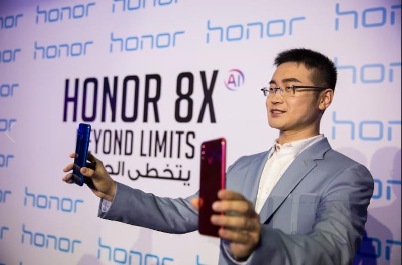 Chris Sunbaigong, president of Honor MEA, during the launch of the new 8X smartphone in Dubai. The National  